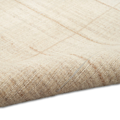 Beige woven rug close-up with subtle tan linear pattern and rolled edge.