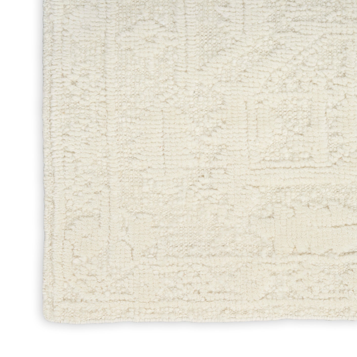 Cream textured area rug with a subtle geometric border and plush, soft pile.