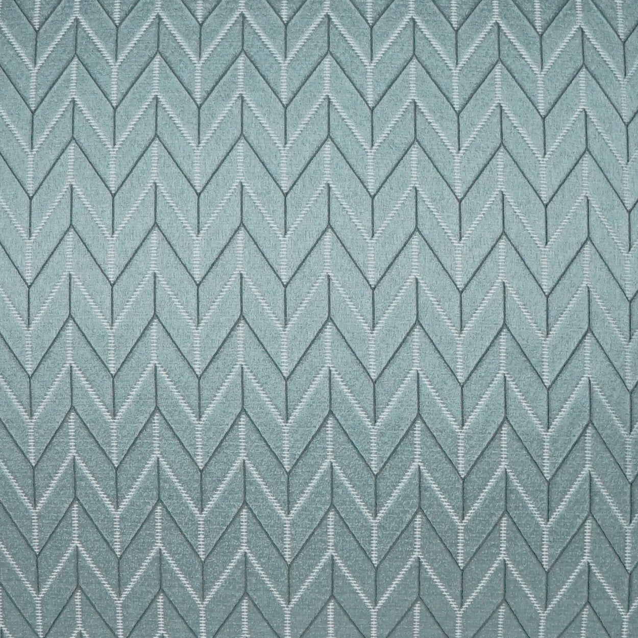 Teal-blue chevron herringbone fabric with raised silver stitching and textured weave.