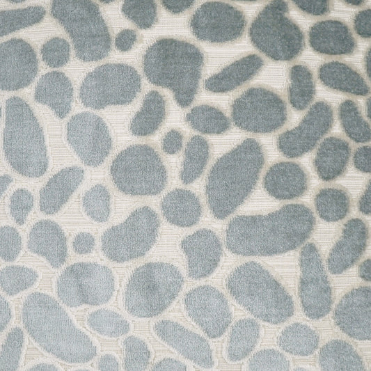 Light blue pebble-pattern fabric with irregular rounded shapes on a pale striped backdrop; soft, textured textile.