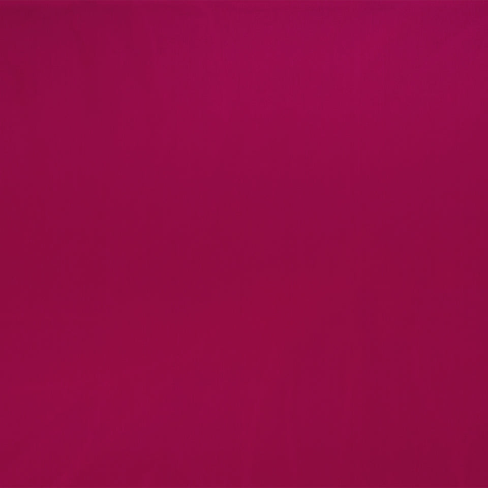 Solid magenta background with subtle shading; smooth, pattern-free color backdrop.