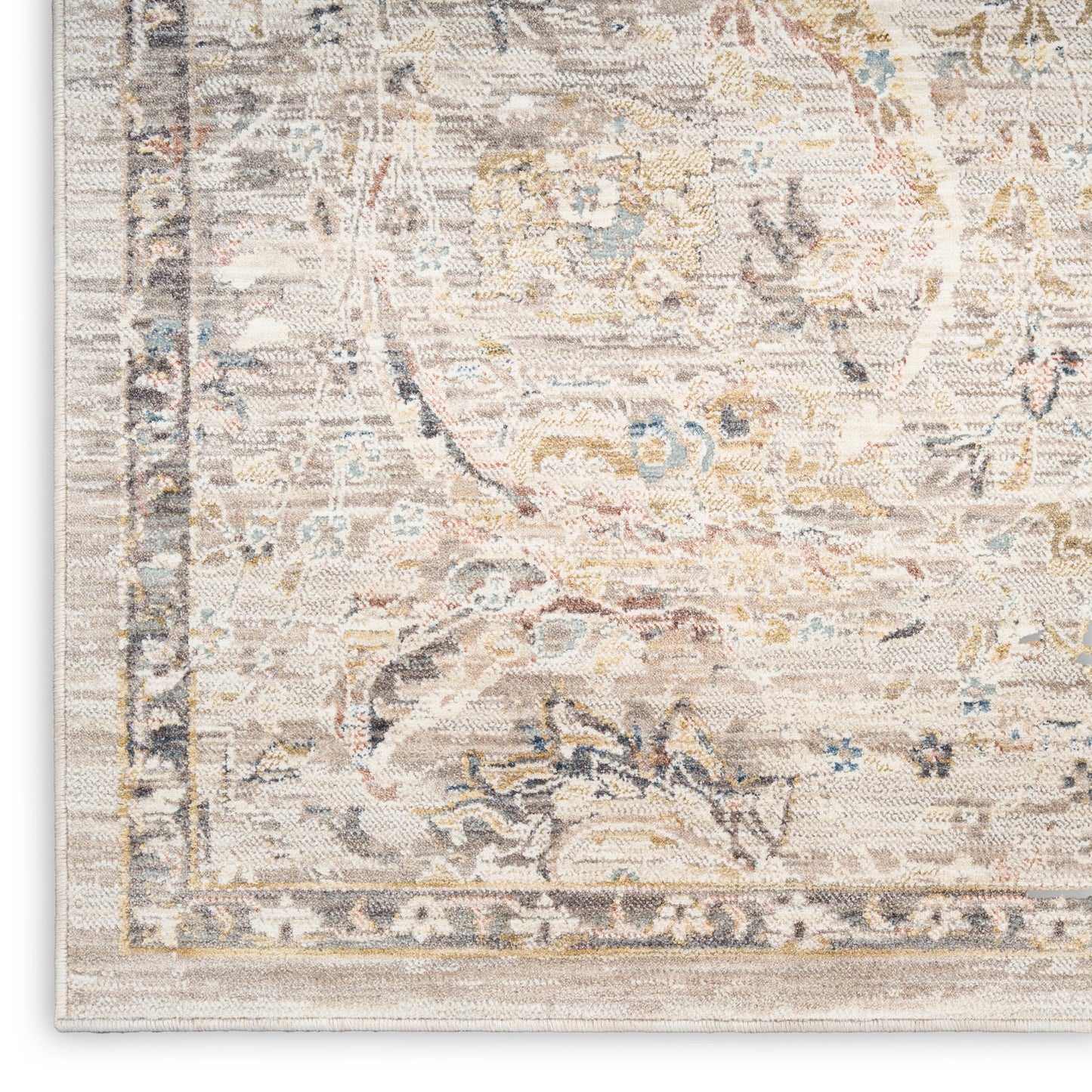 Cream-toned oriental rug featuring muted blue, gold and grey floral motifs and a light beige border.