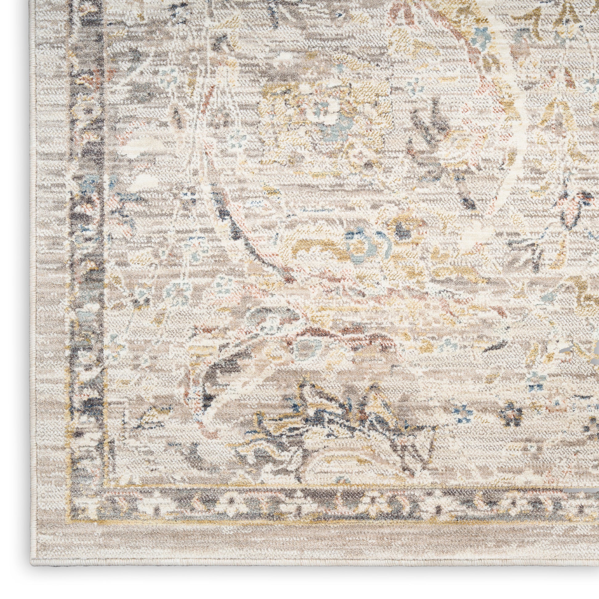 Cream-toned oriental rug featuring muted blue, gold and grey floral motifs and a light beige border.