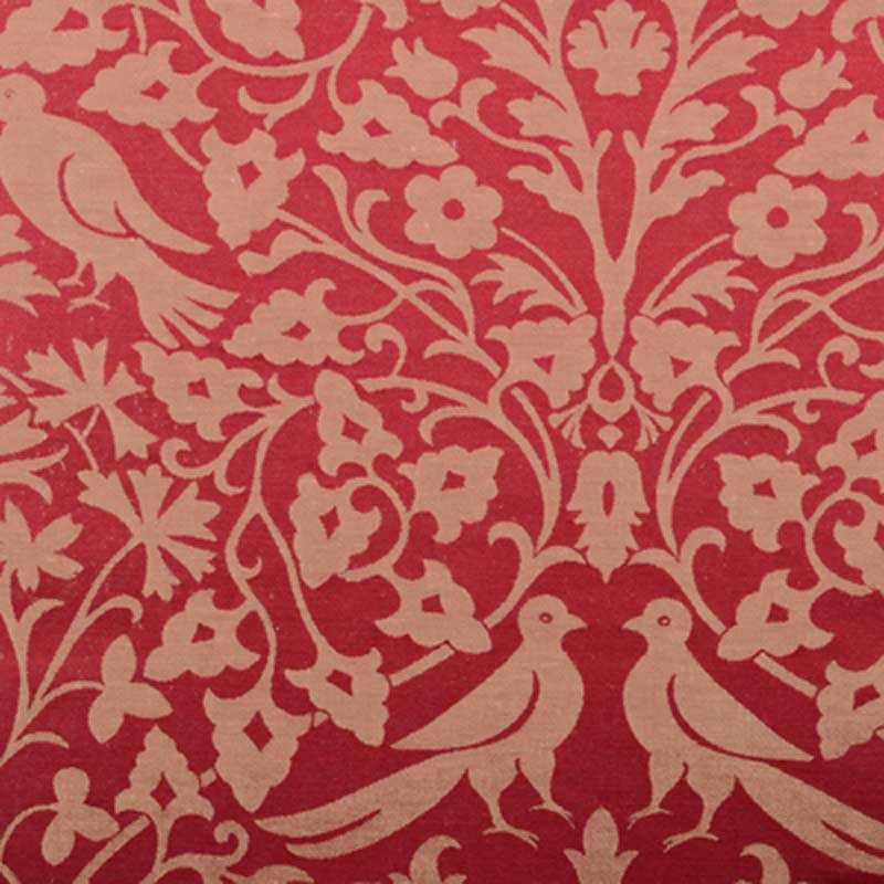 Red damask fabric with beige floral vines and two birds motif.