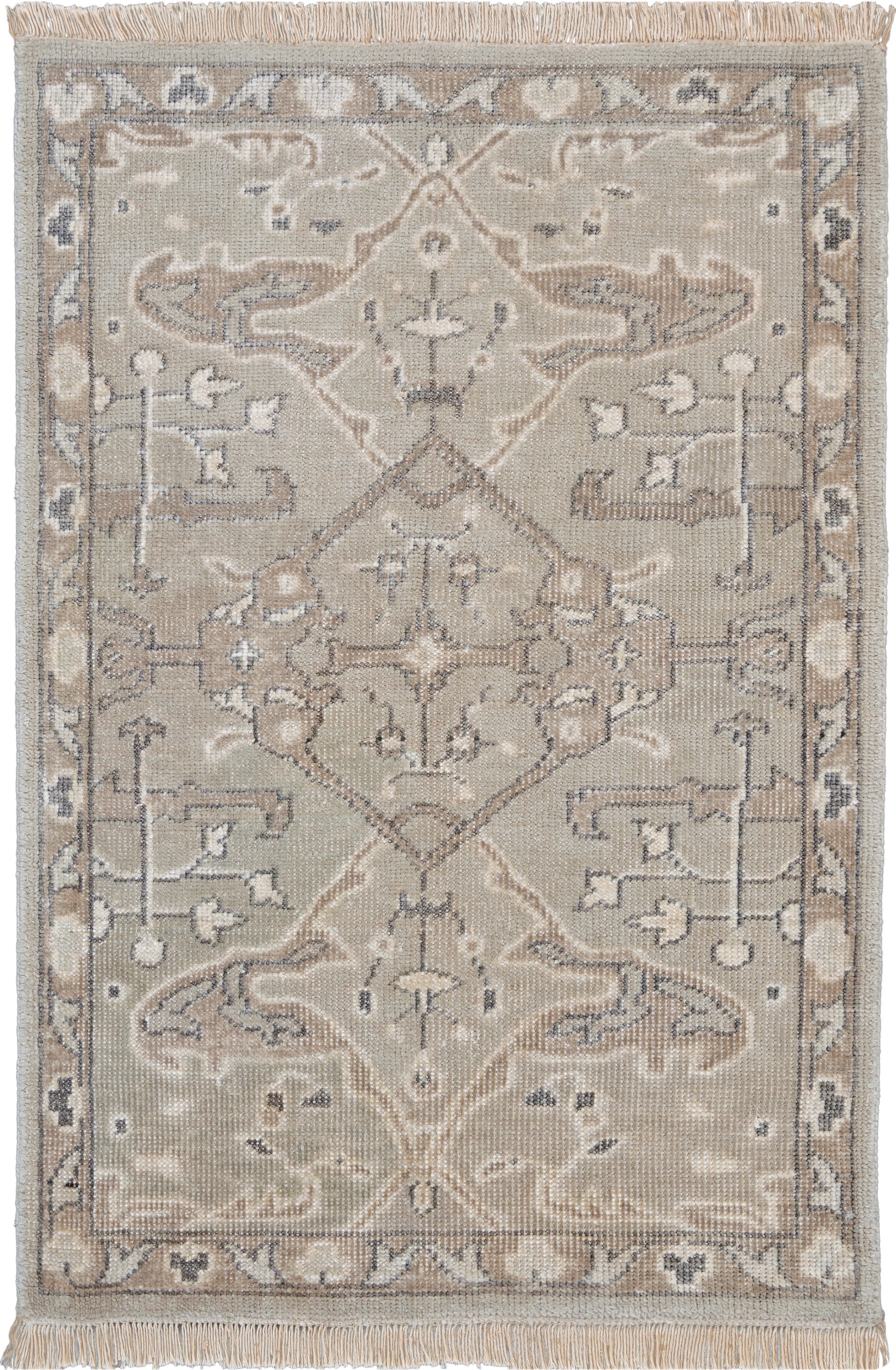 Beige oriental area rug with faded gray-blue accents, central medallion and scrolling floral border; fringed ends.