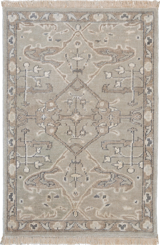 Beige oriental area rug with faded gray-blue accents, central medallion and scrolling floral border; fringed ends.
