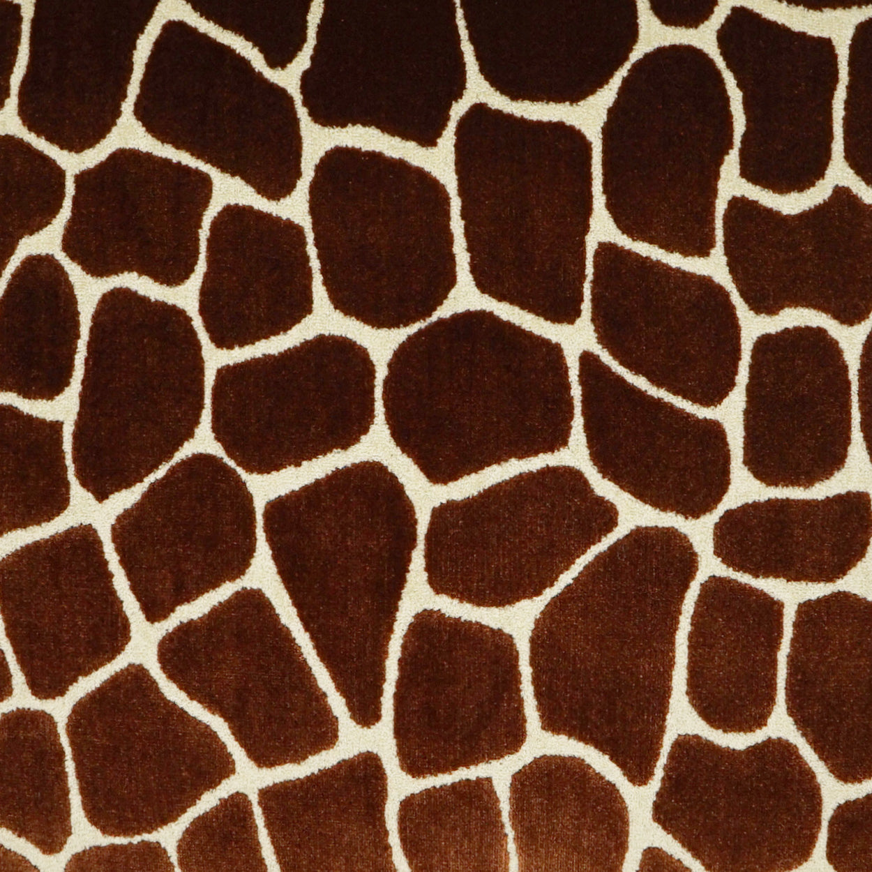 Giraffe-print brown fabric with beige outlines; plush upholstery or apparel textile.