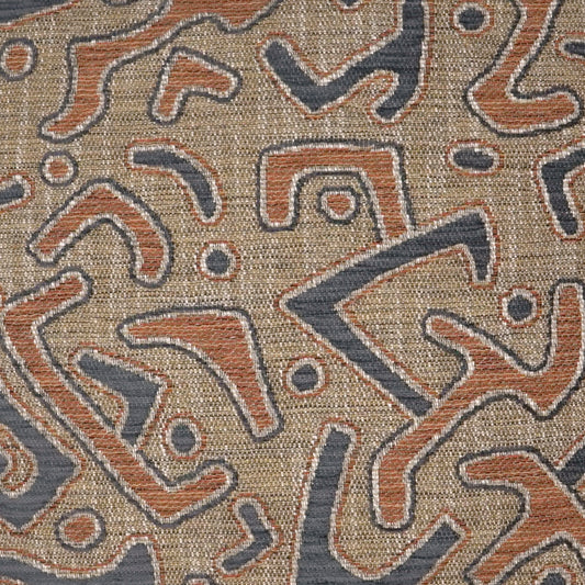 Woven beige fabric with abstract orange and navy blue shapes in a boho tribal pattern.