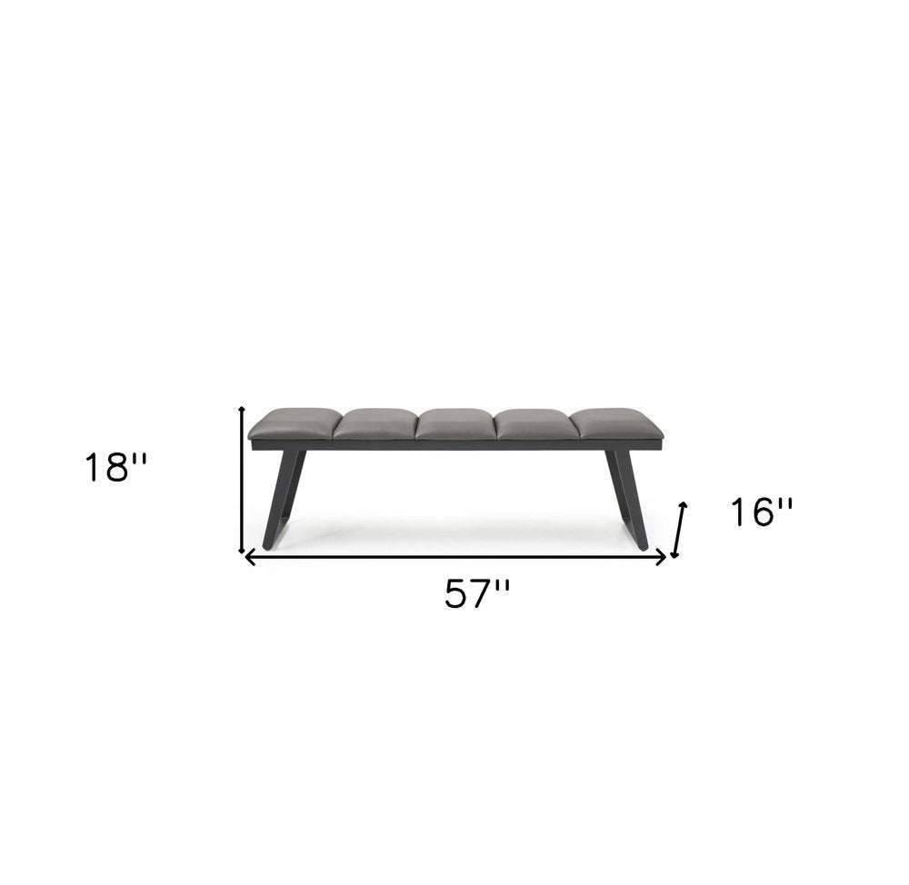 Modern bench with five gray cushions on black angled legs, 57 inches long, 18 inches tall, 16 inches deep.