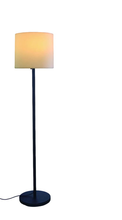 Blue metal floor lamp with a slim stem, round base and warm beige fabric drum shade.
