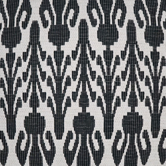 Close-up of black and white damask-inspired fabric with repeating floral-vine motifs