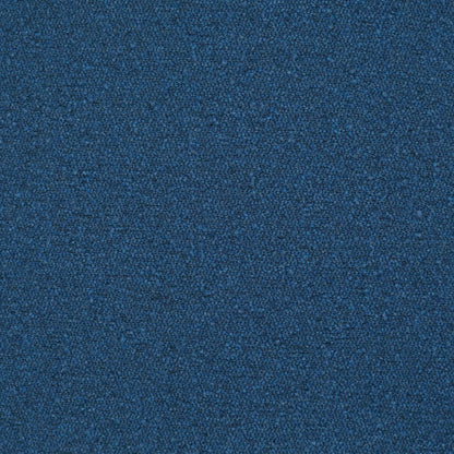 Blue textured pillow with a tight looped weave.