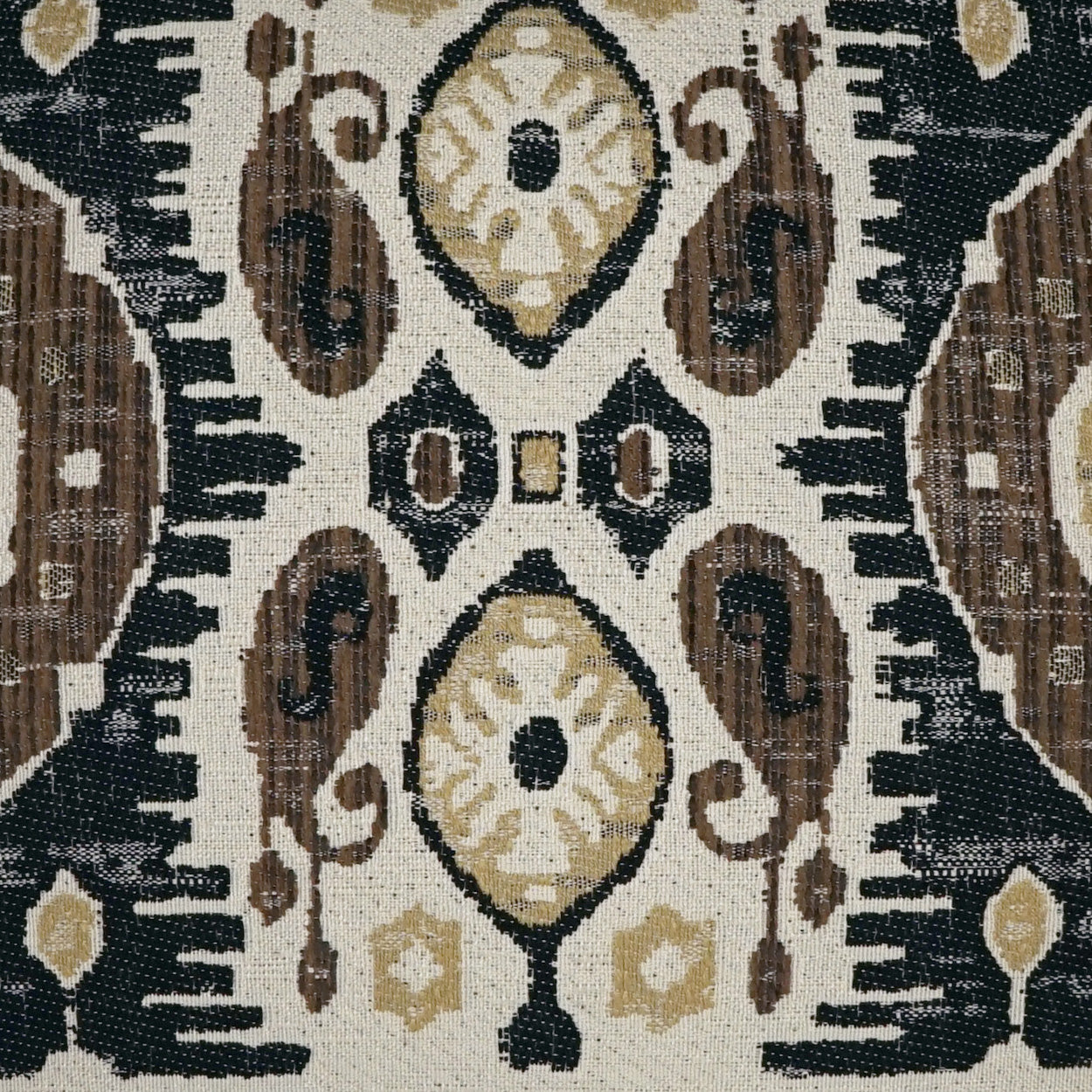 Beige woven textile with brown, black and gold oriental medallions; ornate tapestry rug-like fabric for decor or upholstery.