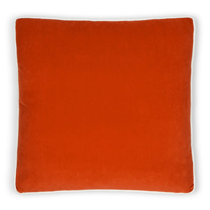 Square orange velvet cushion with white piping trim.