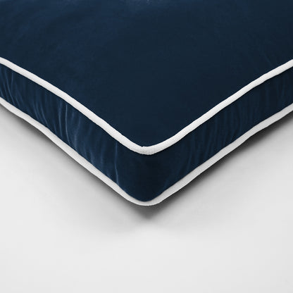 Close-up of navy blue velvet pillow.