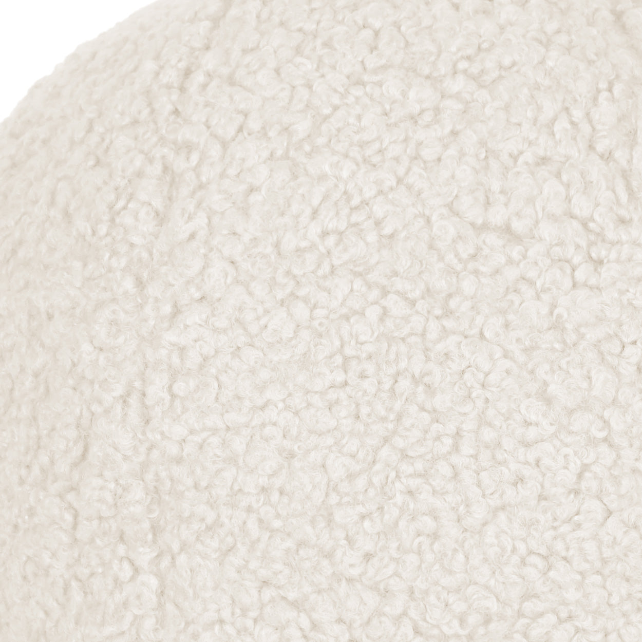 Ivory solid faux fur pillow close-up; plush, curly texture.