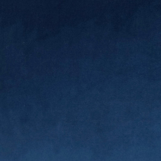Deep blue fabric texture close-up, soft nap and subtle color variation.