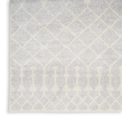 Light gray and ivory woven rug with diamond lattice pattern and arched border motif, beige edging.