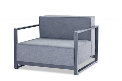 Contemporary blue-gray fabric cushions on a dark steel square-frame lounge chair with boxed arms.