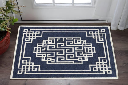 5' X 7' Navy Blue And Ivory Wool Geometric Hand Tufted Area Rug