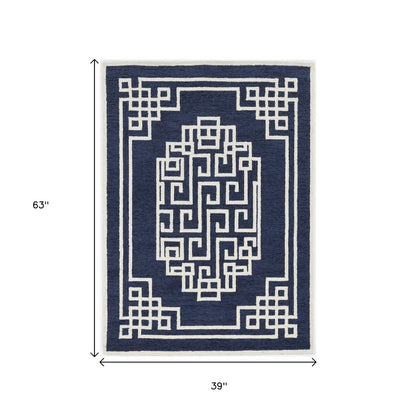 5' X 7' Navy Blue And Ivory Wool Geometric Hand Tufted Area Rug