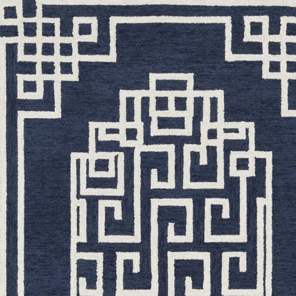 5' X 7' Navy Blue And Ivory Wool Geometric Hand Tufted Area Rug