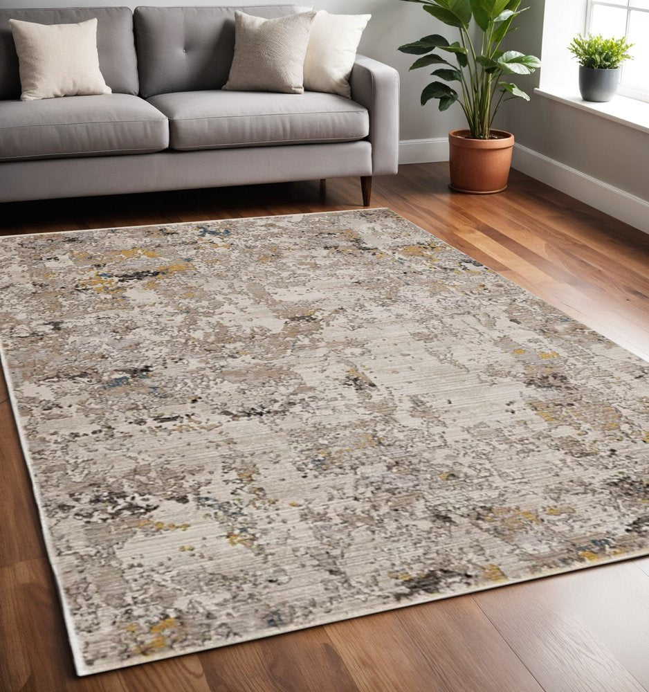 5' X 7' Beige Tan And Gold Abstract Hand Loomed Distressed Area Rug
