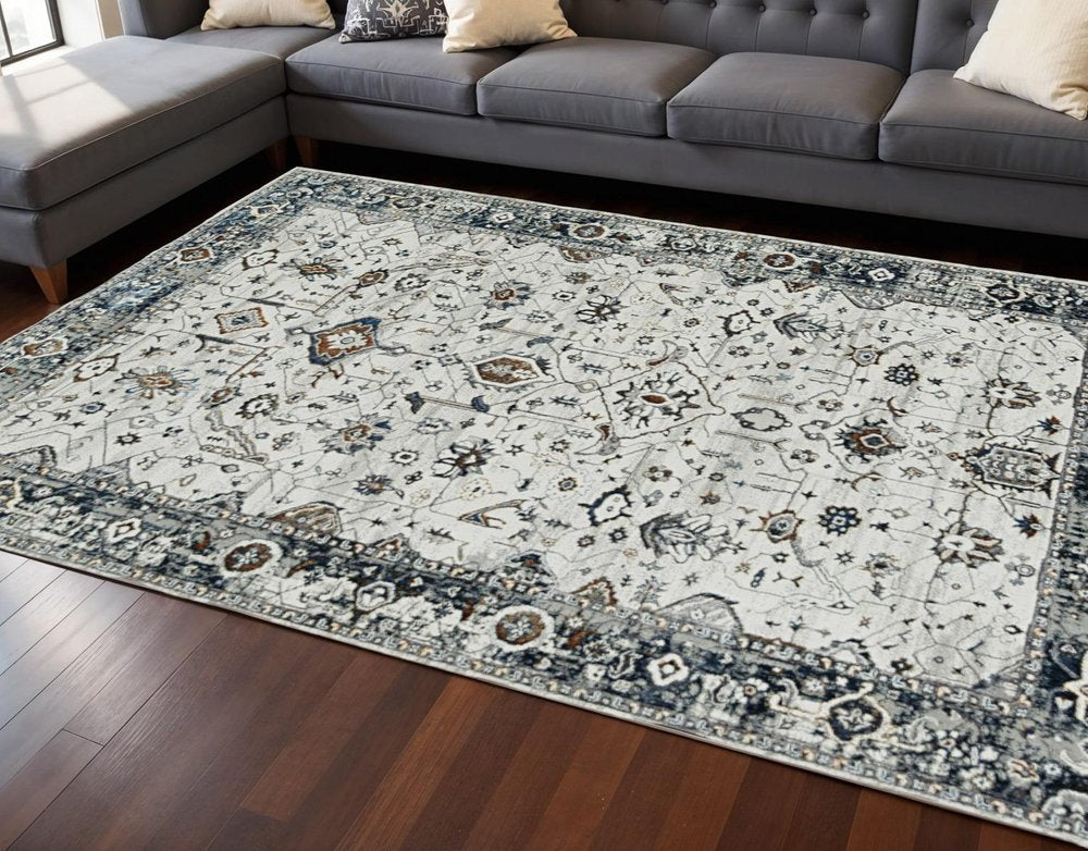 7' Gray And Ivory Floral Medallion Area Rug