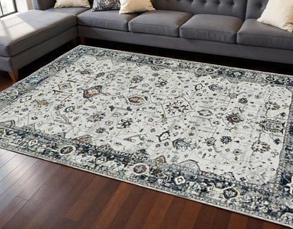 7' Gray And Ivory Floral Medallion Area Rug