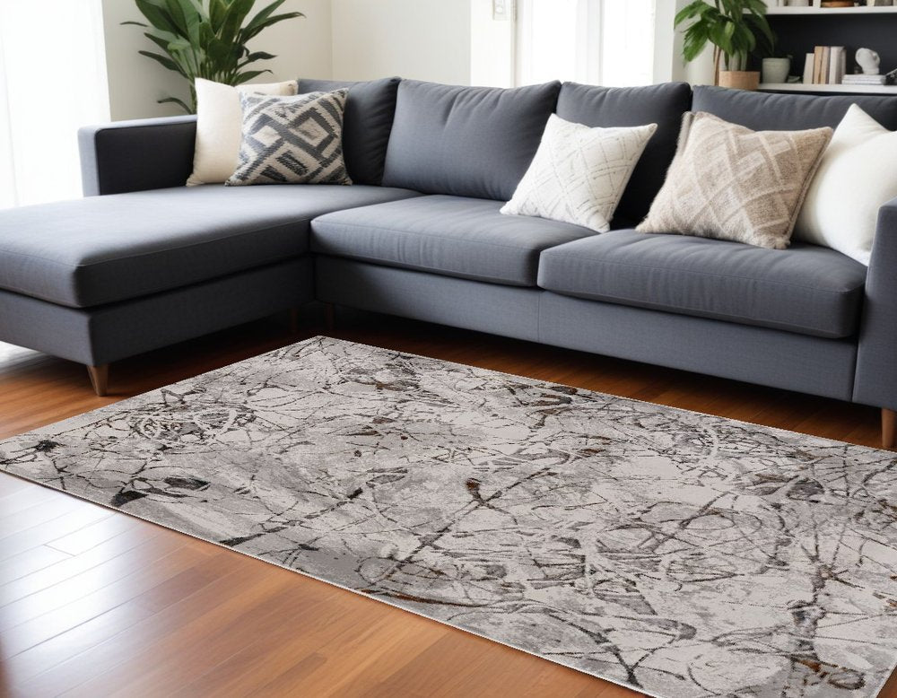 8' X 11' Ivory Gray And Brown Abstract Area Rug
