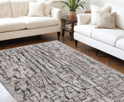 6' X 9' Gray And Black Abstract Distressed Area Rug