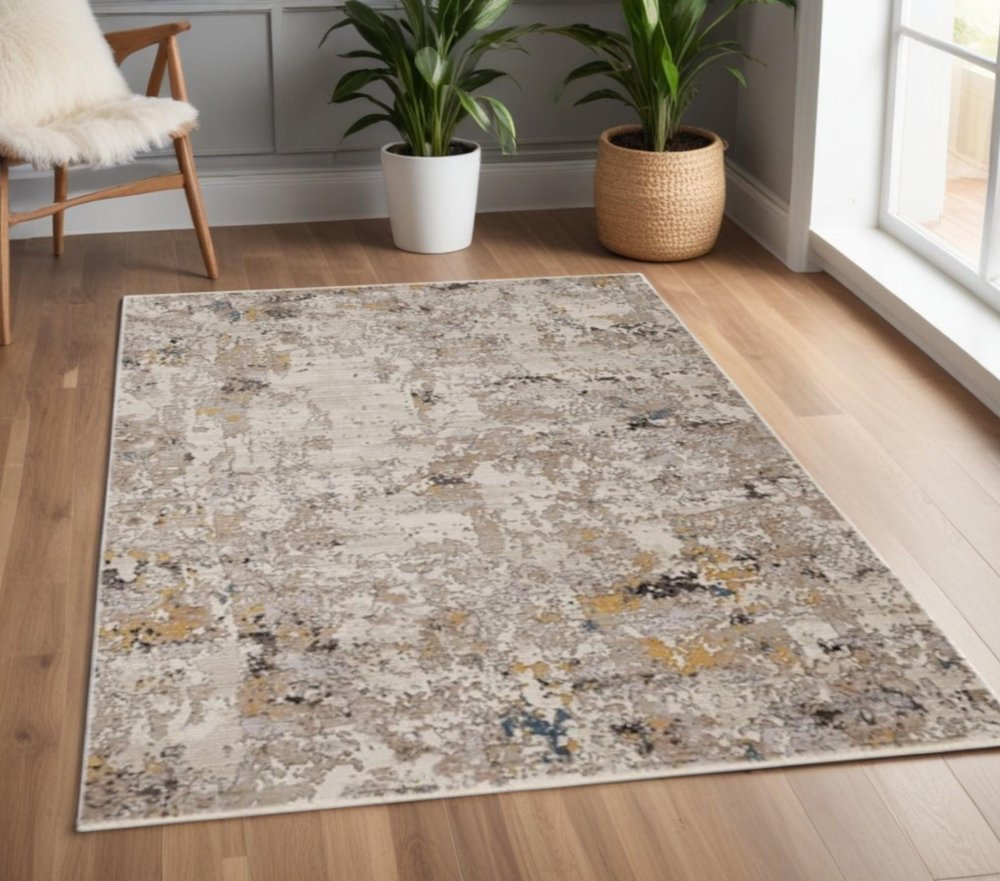 4' X 6' Beige Tan And Gold Abstract Distressed Area Rug
