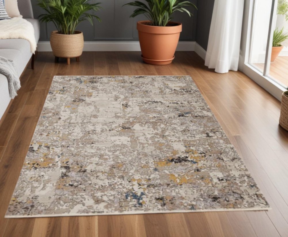 4' X 5' Beige Tan And Gold Abstract Area Rug