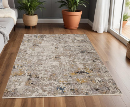 4' X 5' Beige Tan And Gold Abstract Area Rug