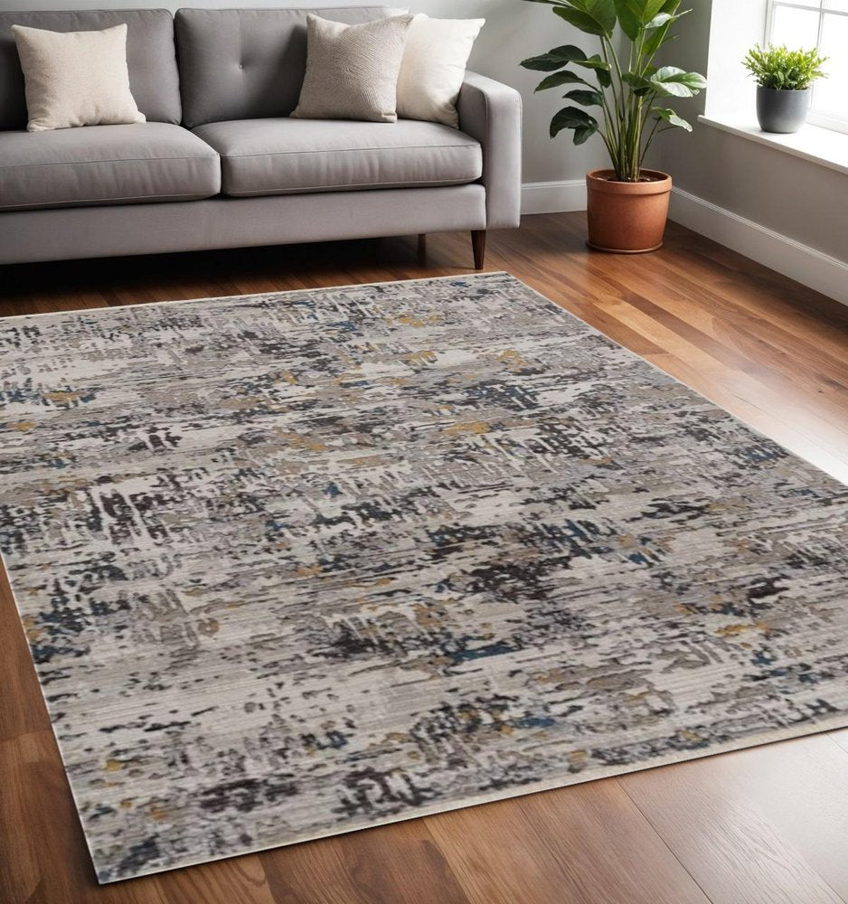 4' X 5' Beige Tan And Gold Abstract Area Rug