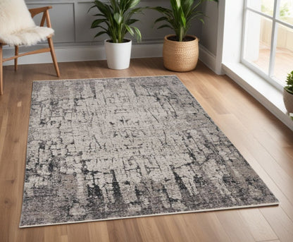5' X 8' Ivory And Gray Abstract Distressed Area Rug