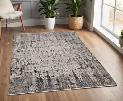 5' X 8' Ivory And Gray Abstract Distressed Area Rug