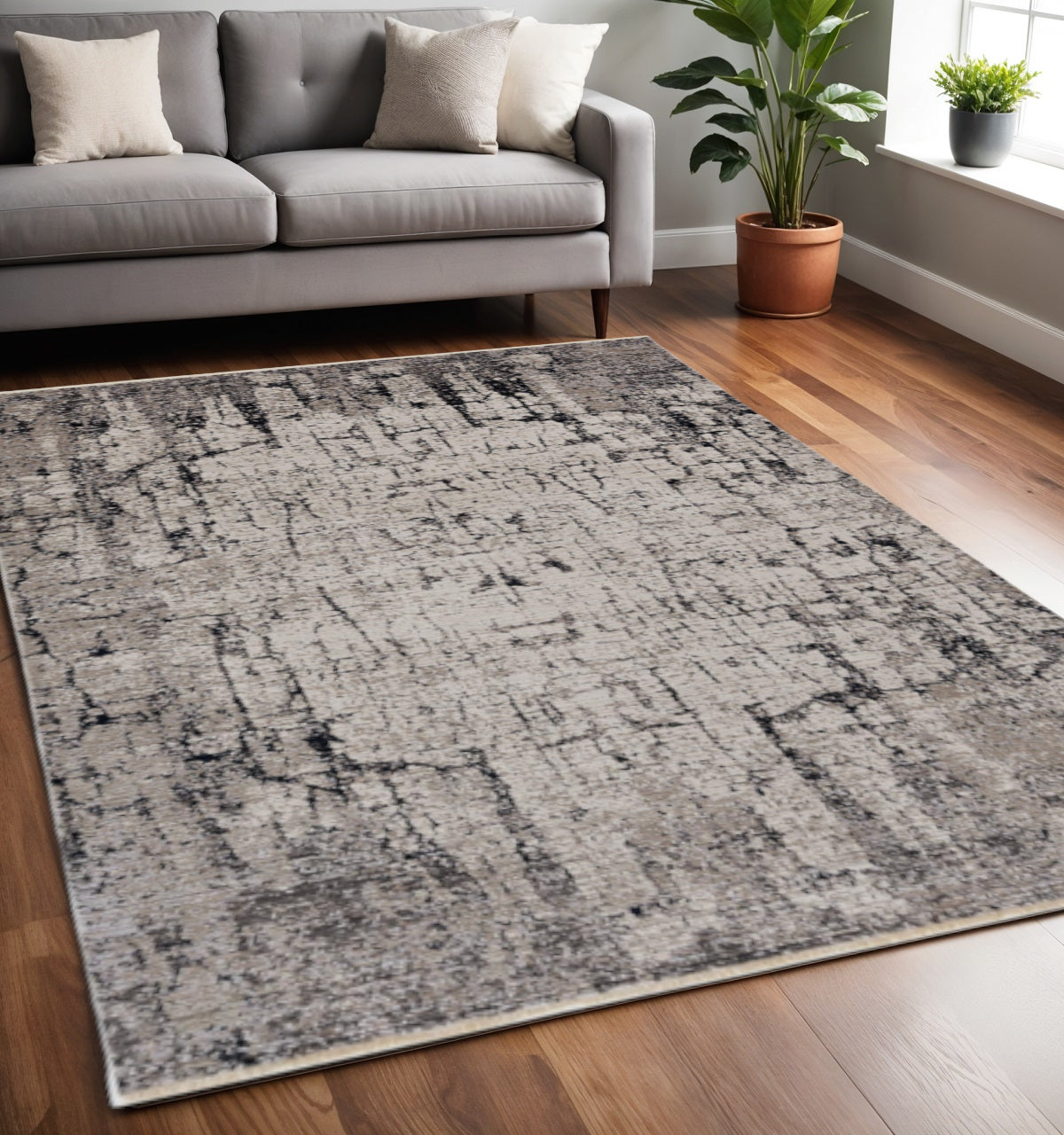 5' X 8' Ivory And Gray Abstract Distressed Area Rug