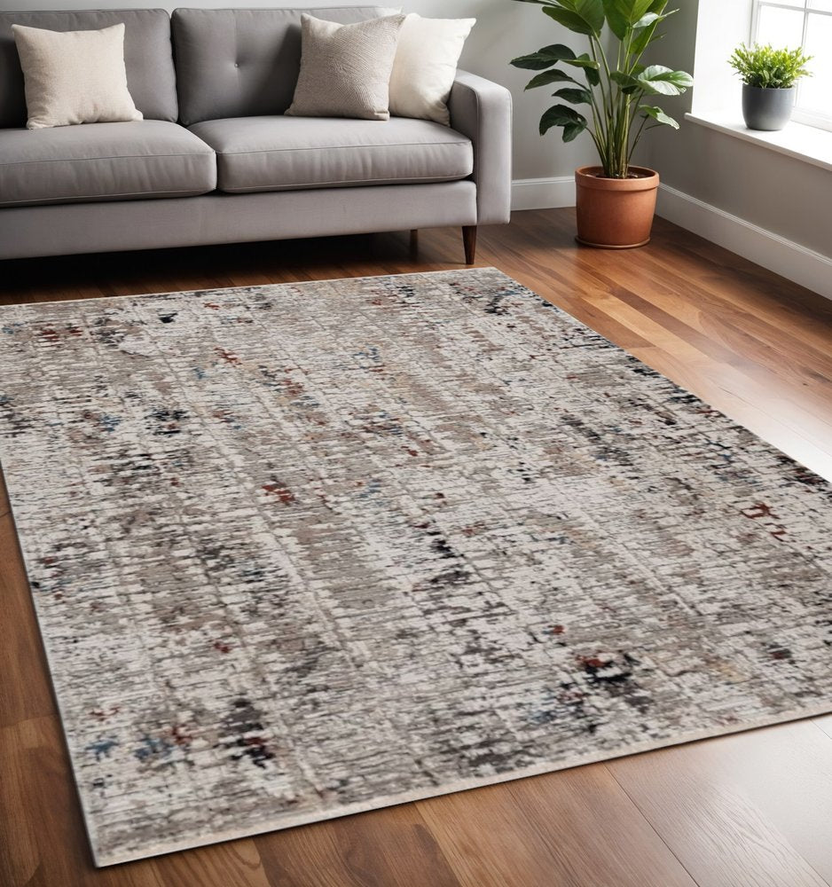 5' X 8' Beige And Gray Abstract Distressed Area Rug
