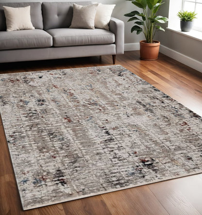 5' X 8' Beige And Gray Abstract Distressed Area Rug