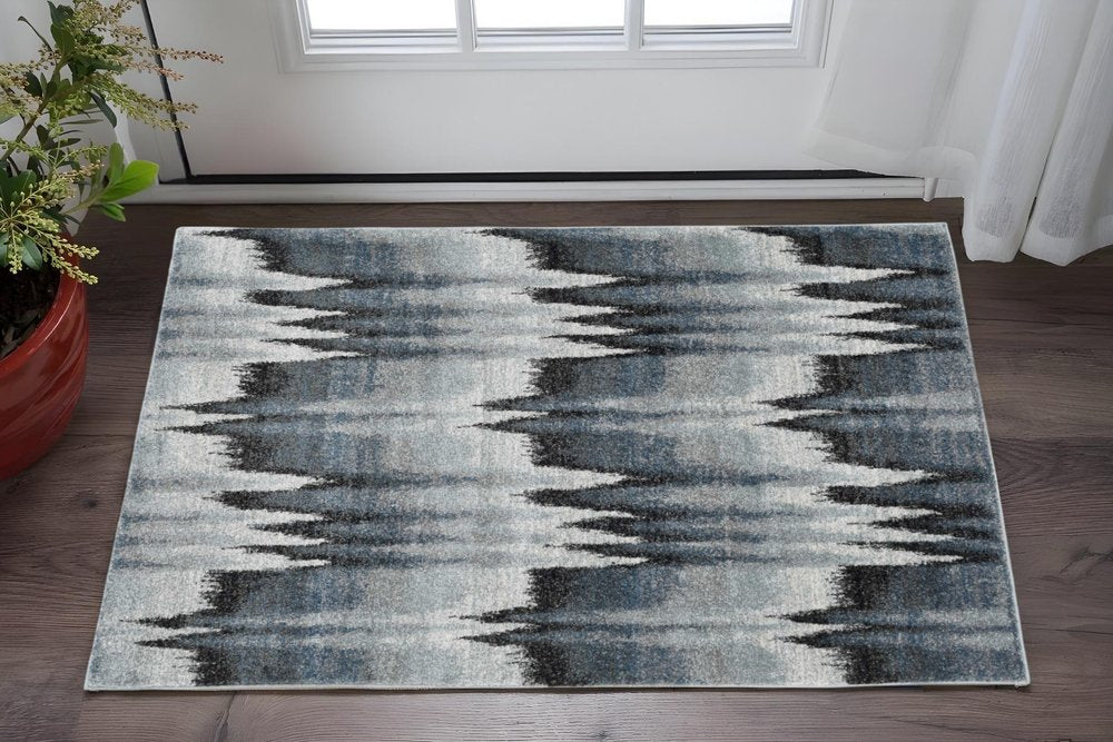 5' X 8' Ivory Blue And Gray Abstract Area Rug