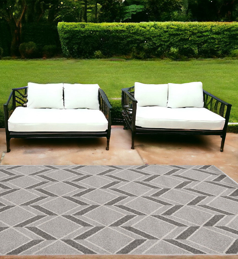 2' X 4' Green and Ivory Geometric Indoor Outdoor Area Rug