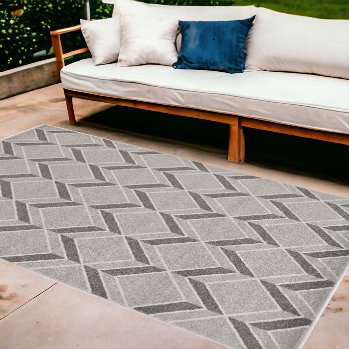 2' X 4' Green and Ivory Geometric Indoor Outdoor Area Rug