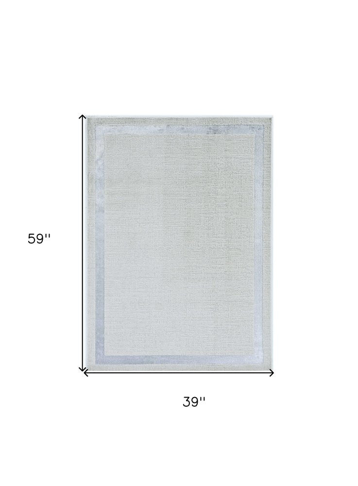 5' X 8' Gray And Ivory Geometric Area Rug