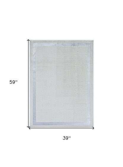 5' X 8' Gray And Ivory Geometric Area Rug