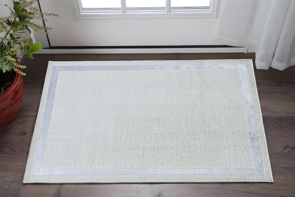 5' X 8' Gray And Ivory Geometric Area Rug