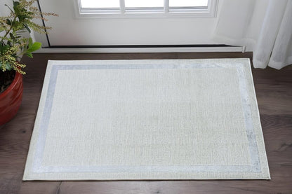 5' X 8' Gray And Ivory Geometric Area Rug
