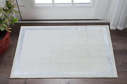 5' X 8' Gray And Ivory Geometric Area Rug