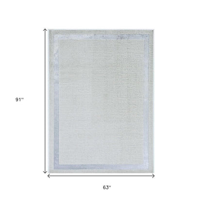 5' X 8' Gray And Ivory Geometric Area Rug