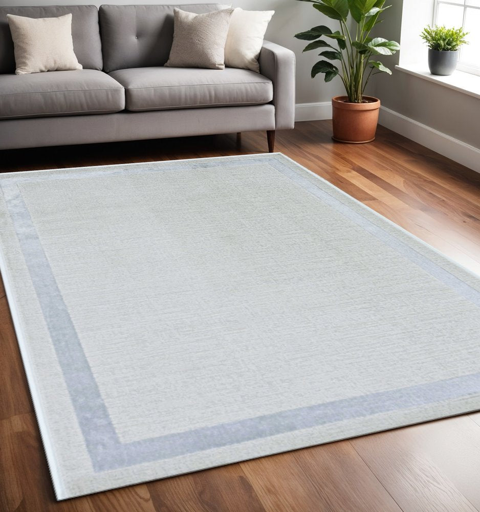 5' X 8' Gray And Ivory Geometric Area Rug